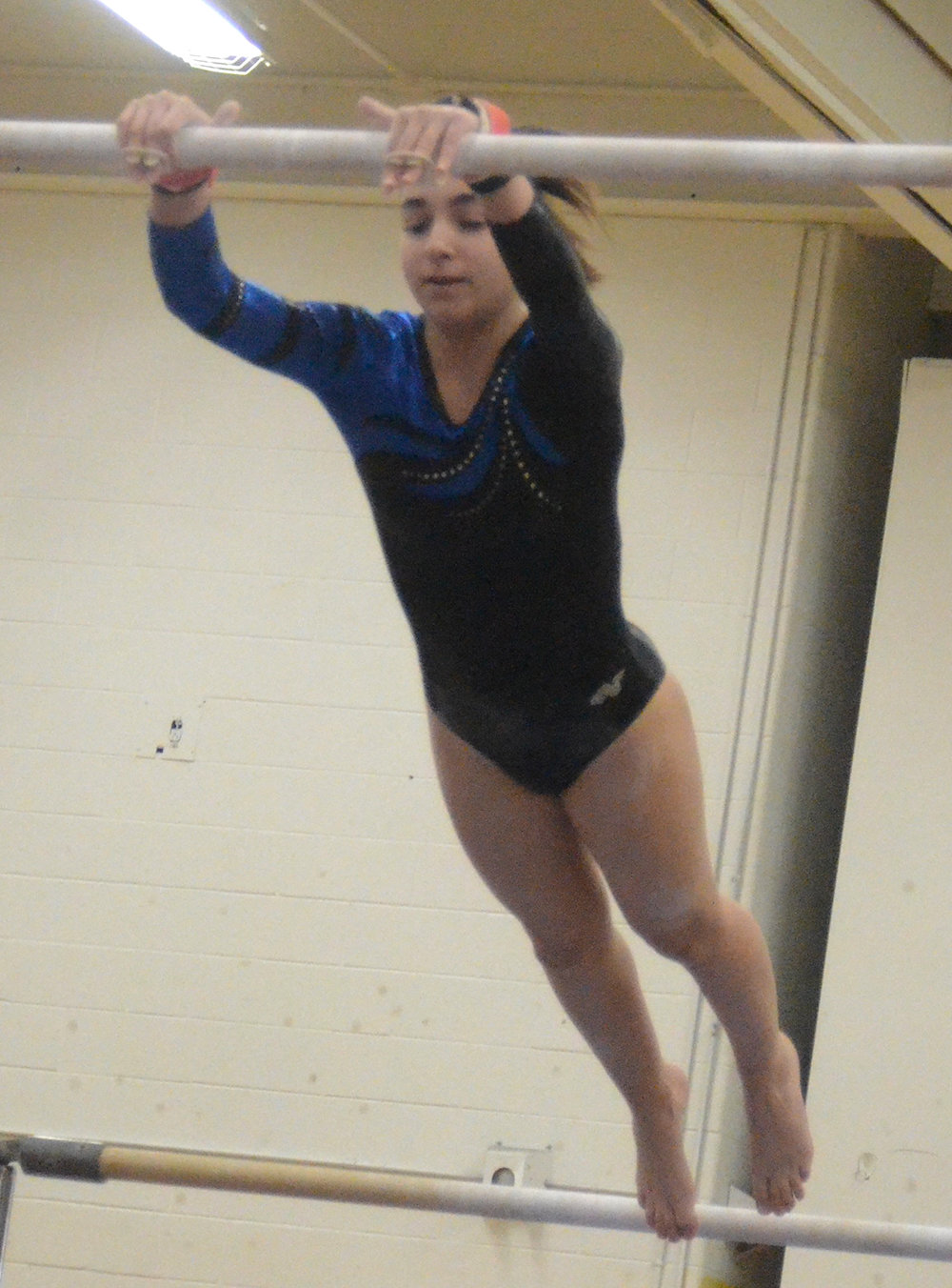 Wallkill’s Chloe Quattrochi performs on the uneven bars during the Section 9 gymnastic championship meet at Roosevelt High School in Hyde Park on Feb. 19, 2020.